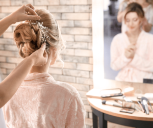 Bride getting wedding hair pieces put in. 
